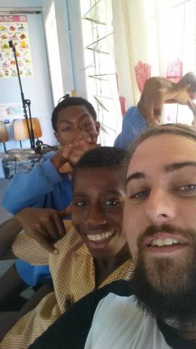 Matthew and some students posing for a selfie